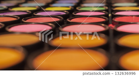 Abstract macro close-up of a colorful makeup or artist paint palette with shallow depth of field. Symbolize creativity, art, and cosmetics Abstract macro close-up of a colorful makeup or artist paint palette with shallow depth of field. Symbolize creativity, art, and cosmetics 132636996