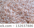 Pink Himalayan salt in a close-up view showcasing its coarse texture and natural color variations 132637886