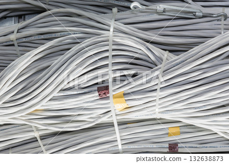 bunch of network cables in wave pattern leading across server ro bunch of network cables in wave pattern leading across server ro 132638873