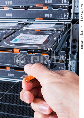 Cloud storage service, engineer pulling out panel and swapping h Cloud storage service, engineer pulling out panel and swapping h 132638875