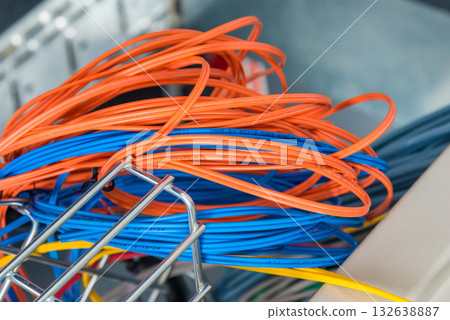 Detail of server room with bunch of fiber optic cables at the ba Detail of server room with bunch of fiber optic cables at the ba 132638887