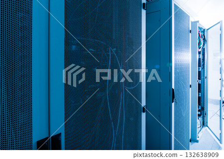 Racks filled with computer hardware inside internet datacenter Racks filled with computer hardware inside internet datacenter 132638909