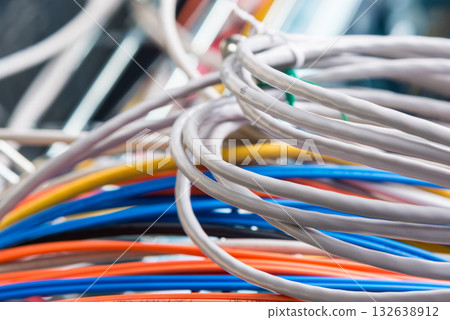 Detail of server room with bunch of fiber optic cables and ether Detail of server room with bunch of fiber optic cables and ether 132638912