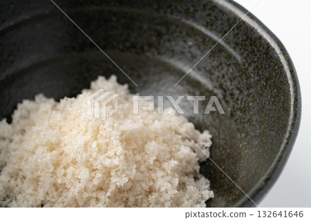 Close-up of a small bowl of seaweed salt Close-up of a small bowl of seaweed salt 132641646