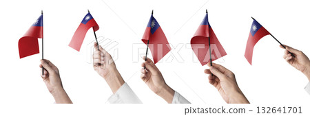 The Taiwan flag in hand in different angles on a white background 132641701