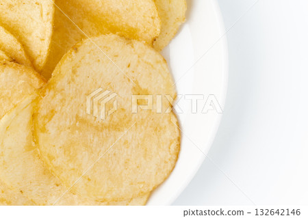 Close-up of potato chips on a plate 132642146