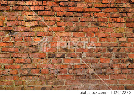 Old brick wall weathered and broken bricks, background Old brick wall weathered and broken bricks, background 132642220