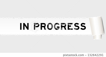 Ripped gray paper background that have word in progress under torn part 132642291