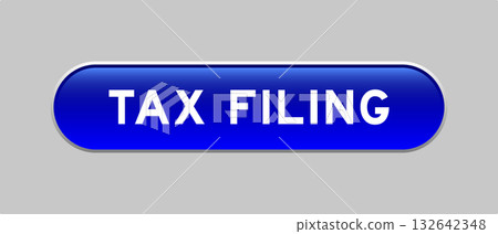 Blue color capsule shape button with word tax filing on gray background 132642348