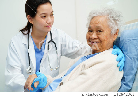 Asian doctor checking and treat elderly woman patient health in hospital. 132642365