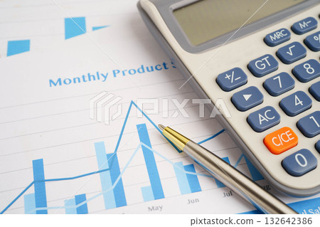 Calculator on chart graph paper. Finance, account, statistic, investment data economy, stock exchange business. 132642386