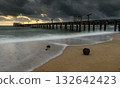 Coconut on the beach under a stormy sunset sky. 132642423