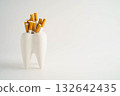 Cigarette with teeth isolated on white background, damage the health of your teeth, No smoking. 132642435