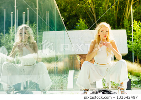 Woman wearing crop top and culottes Woman wearing crop top and culottes 132642487