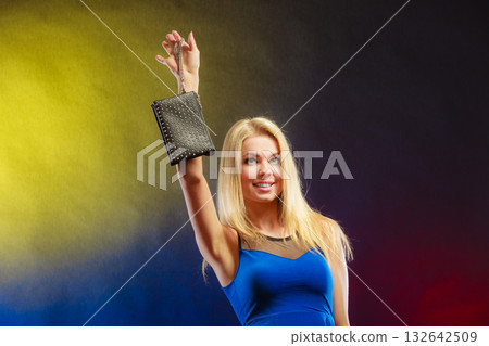 Elegant woman holds black handbag Elegant woman holds black handbag 132642509