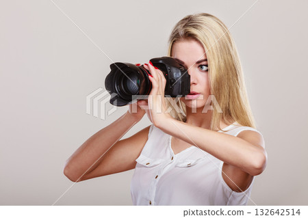 Beautiful woman with camera. Beautiful woman with camera. 132642514