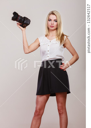 Beautiful woman with camera. Beautiful woman with camera. 132642517
