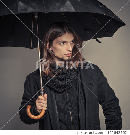 Handsome fashion man portrait wearing black coat. Handsome fashion man portrait wearing black coat. 132642762