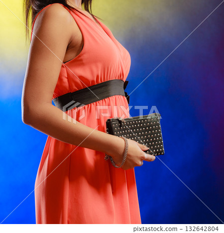 Evening handbag in woman hand Evening handbag in woman hand 132642804