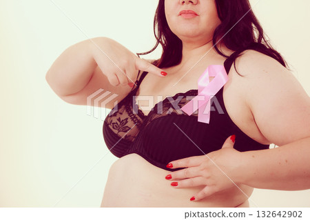 Woman chest in bra, pink cancer ribbon Woman chest in bra, pink cancer ribbon 132642902