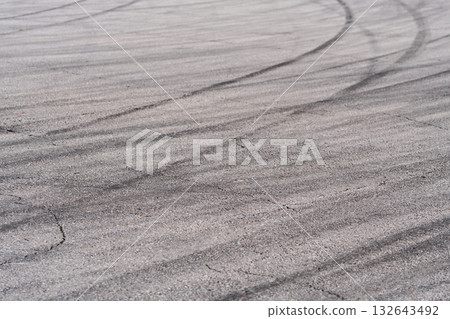 Asphalt with black rubber marks from tyres Asphalt with black rubber marks from tyres 132643492