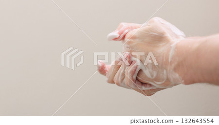 man washing his hands with soap closeup 132643554