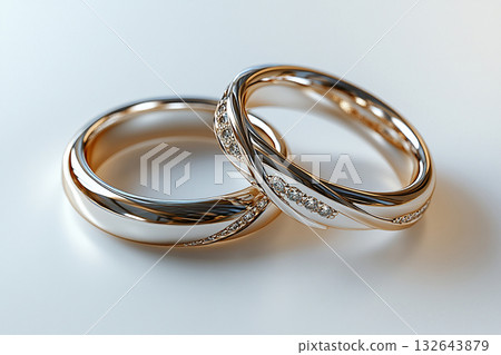 Pair of white gold wedding rings on a white background. 132643879