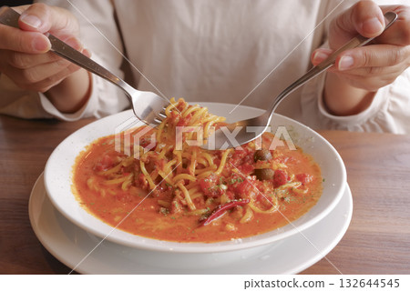Hands of a woman enjoying lunch at a cafe Hands of a woman enjoying lunch at a cafe 132644545