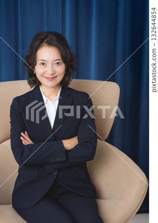 A confident middle-aged woman who has succeeded in business 132644854