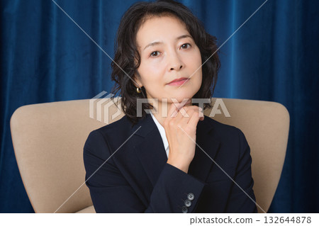 A confident middle-aged woman who has succeeded in business 132644878