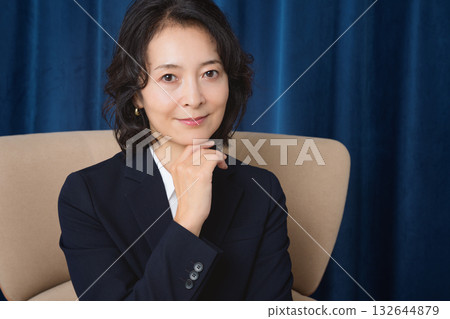 A confident middle-aged woman who has succeeded in business 132644879