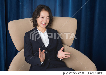 A middle-career woman confidently talking about business 132644893