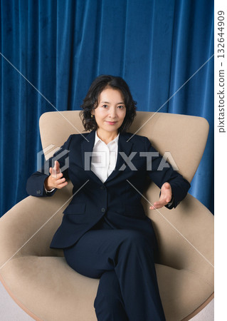 A middle-career woman confidently talking about business A middle-career woman confidently talking about business 132644909