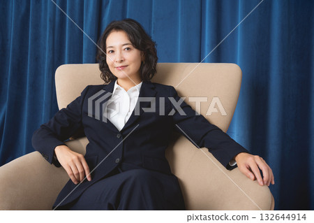 A confident middle-aged woman who has succeeded in business 132644914