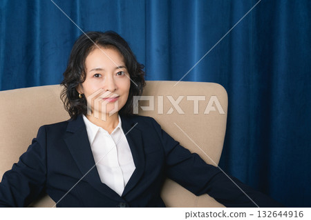 A confident middle-aged woman who has succeeded in business 132644916