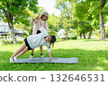 Asian senior woman stand and help her friend to exercise with yoga posture in garden with day light. 132646531