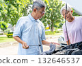 Asian senior man check quality of car engine and support with senior woman in front of house with day light. 132646537