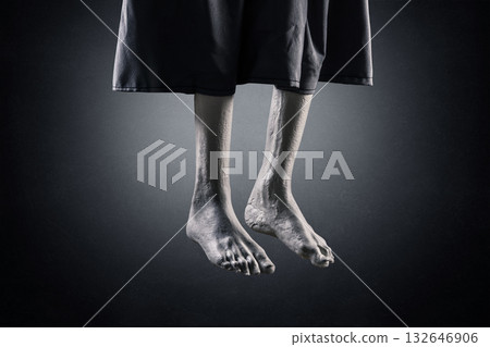 Zombie hanging legs over dark misty background at night Zombie hanging legs over dark misty background at night 132646906