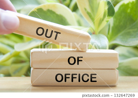 Out of office text on wooden blocks with nature background. Getaway or on a vacation concept. 132647269