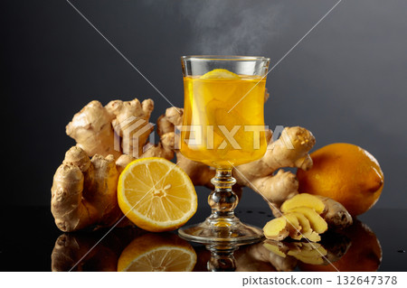 Ginger tea with lemon on a black background. Ginger tea with lemon on a black background. 132647378