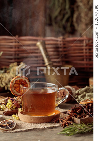Tea with ingredients and slices of dried oranges. 132647390
