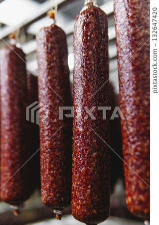 Smoked sausage production line in the factory 132647420