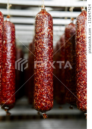 Smoked sausage production line in the factory 132647424