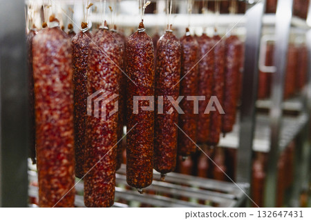 Smoked sausage production line in the factory 132647431