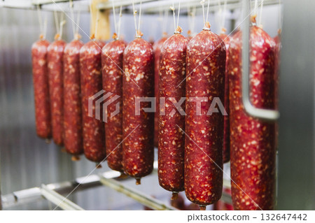 Smoked sausage production line in the factory 132647442