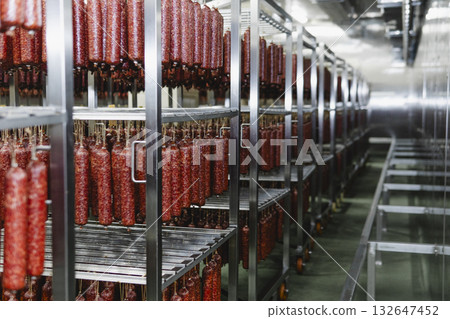 Smoked sausage production line in the factory Smoked sausage production line in the factory 132647452