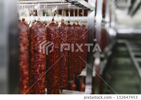 Smoked sausage production line in the factory Smoked sausage production line in the factory 132647453
