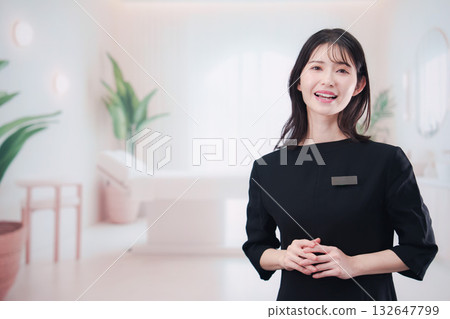 Young female staff working at the salon 132647799