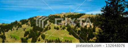 Mountain view with lush greenery and telecommunications tower in clear sky during daytime Mountain view with lush greenery and telecommunications tower in clear sky during daytime 132648076