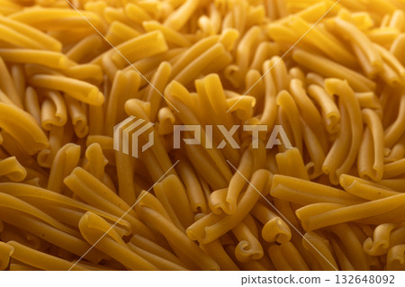 Dry Casarecce Pasta Background, Top View of Uncooked Italian Noodles 132648092